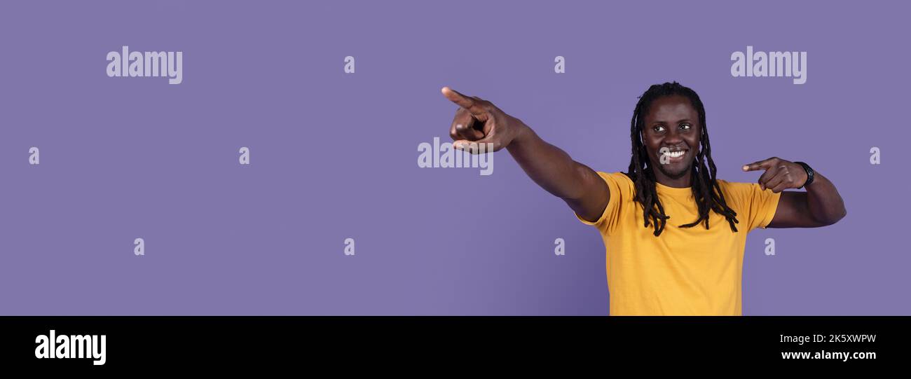 Cool african american young man pointing at copy space Stock Photo