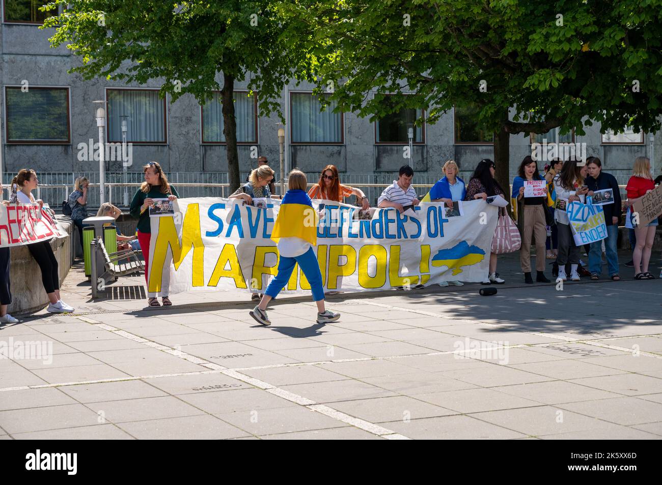 Ukrainians with banners and flags demonstraiting against the war in Aarhus, Denmark on 25 June 2022 Stock Photo