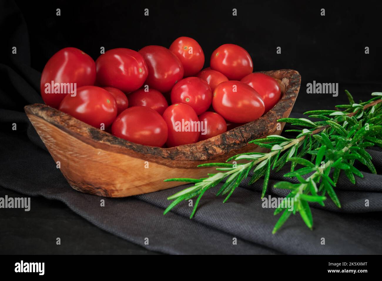 red tomatoes branch on table background, healthy food Stock Photo - Alamy