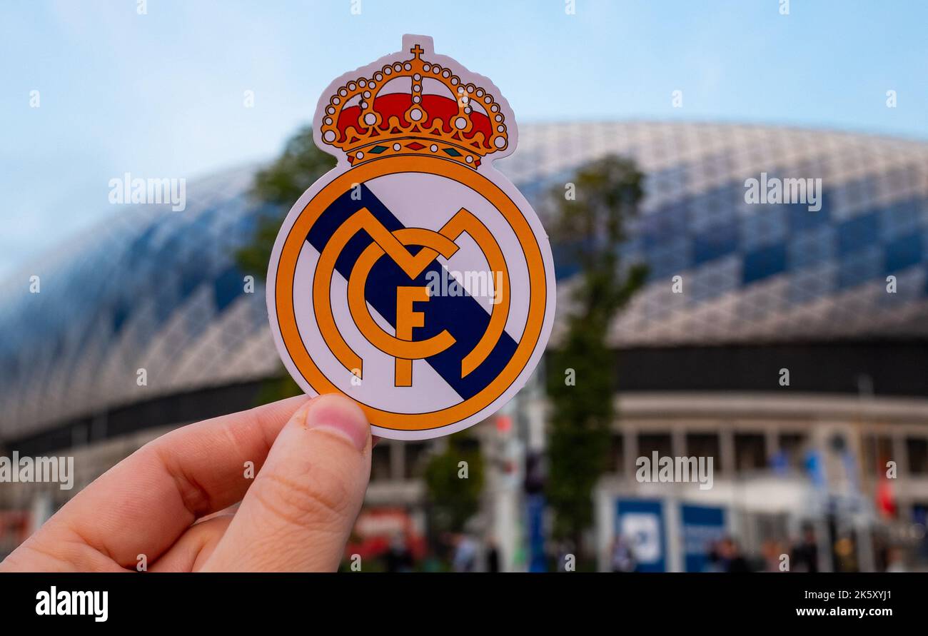 September 12, 2021, Madrid, Spain. The emblem of the football Real Madrid CF against the background of a modern stadium. Stock Photo