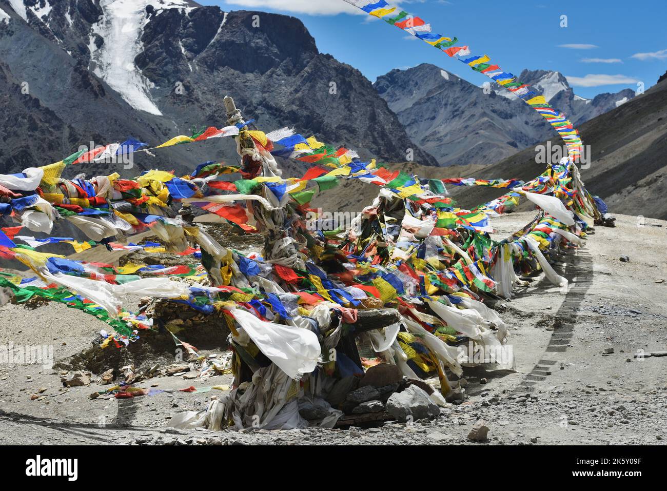 Tibetan prayer flags on a mountain pass in Ladakh, Himalayas, North India. Stock Photo