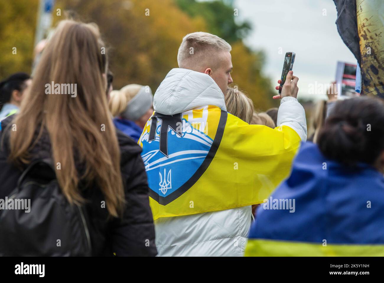 Munich, Bavaria, Germany. 10th Oct, 2022. Flag of the now-defunct Azov Battalion, which was dissolved and merged into the Ukrainian military. Remnants after ejection of the most radical elements remained as the Azov Regiment, who incorporated soldiers of various backgrounds according to Ukrainian military. In the wake of the bombing of the Kerch (Crimea) Bridge over the weekend, Russia has retaliated by indiscriminate rocket and missile attacks on civilians and civilian infrastructure, prompting refugees and Germans in Munich to demand the international community declare Russia as a terrori Stock Photo