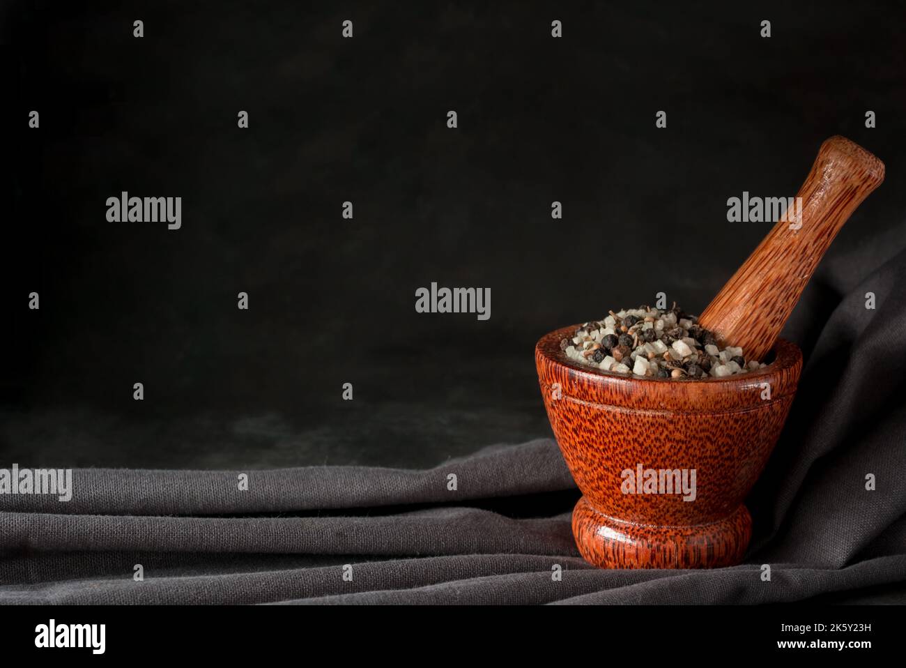 Sea salt and ground black pepper in mortar pestle Stock Photo Alamy