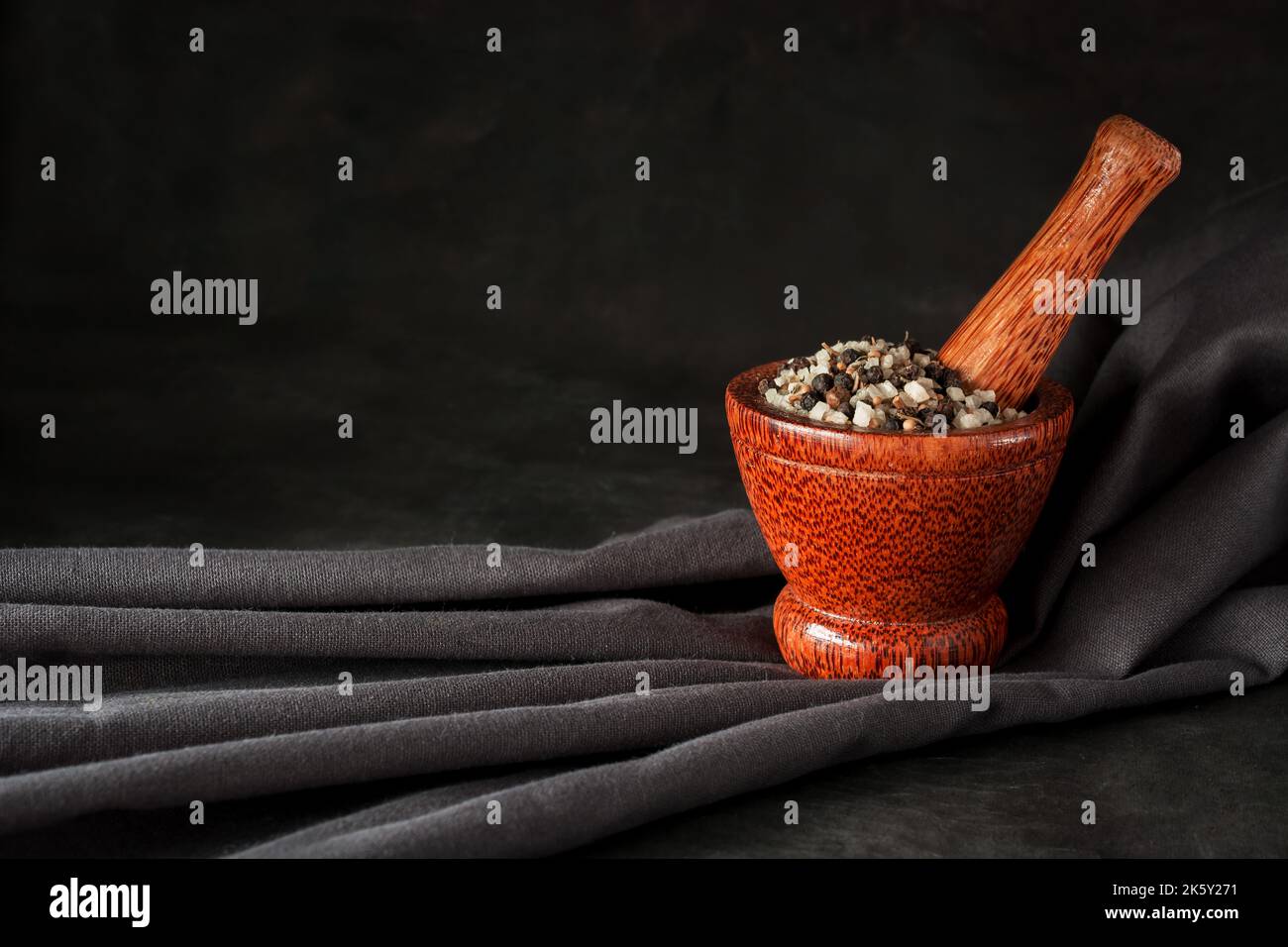 Sea salt and ground black pepper in mortar pestle Stock Photo Alamy