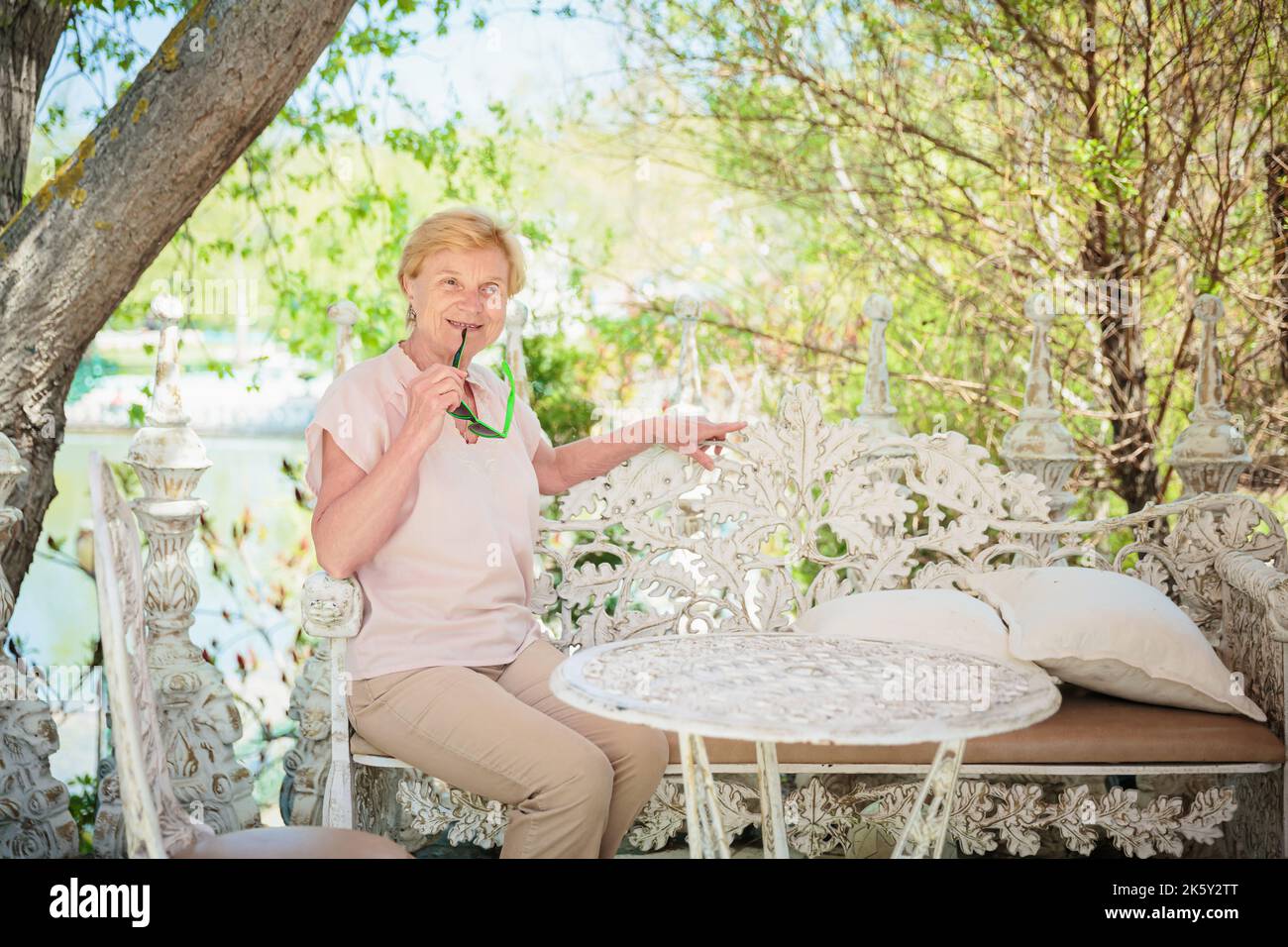 Mature woman alone walking park hi-res stock photography and images - Alamy