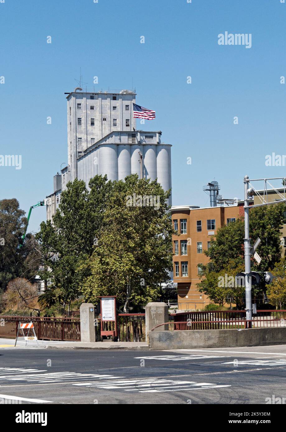 Large mill and other industrial buildings,  in the historic former port town of Petaluma in Sonoma County, California, USA. Stock Photo