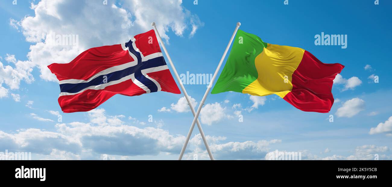 two crossed flags Mali and Norway waving in wind at cloudy sky. Concept ...