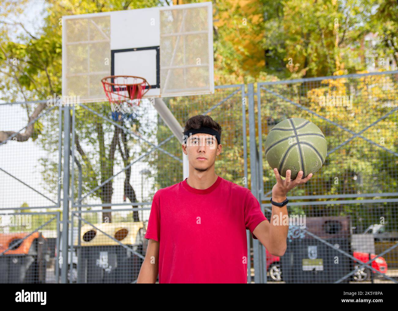 Athletic male playing basketball outdoors Stock Photo Alamy
