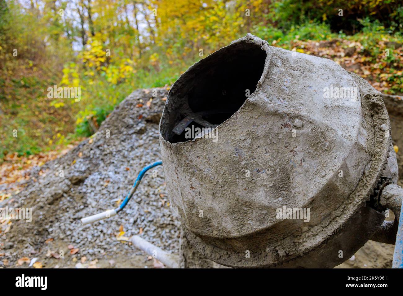Concrete mortar is prepared using an industrial concrete mixer on
