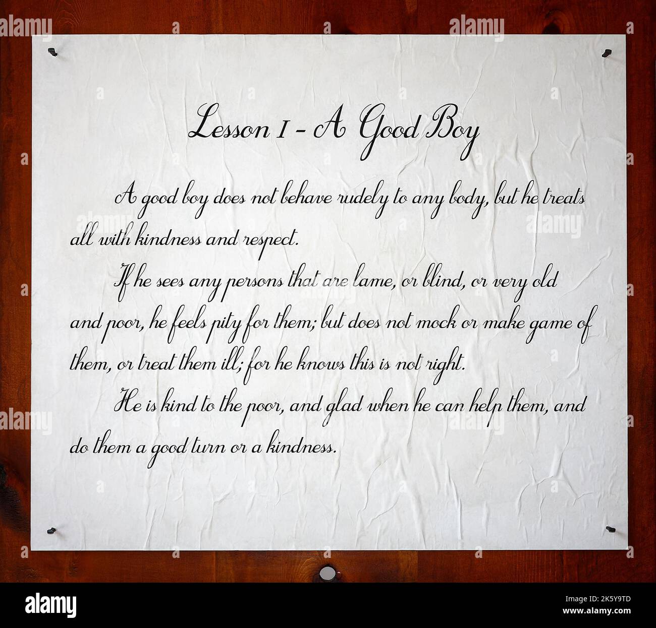 plaque, Lesson 1 - A Good Boy, paper on wood, antique, old saying, text, words, Hagley Museum, Delaware, Wilmington, DE Stock Photo