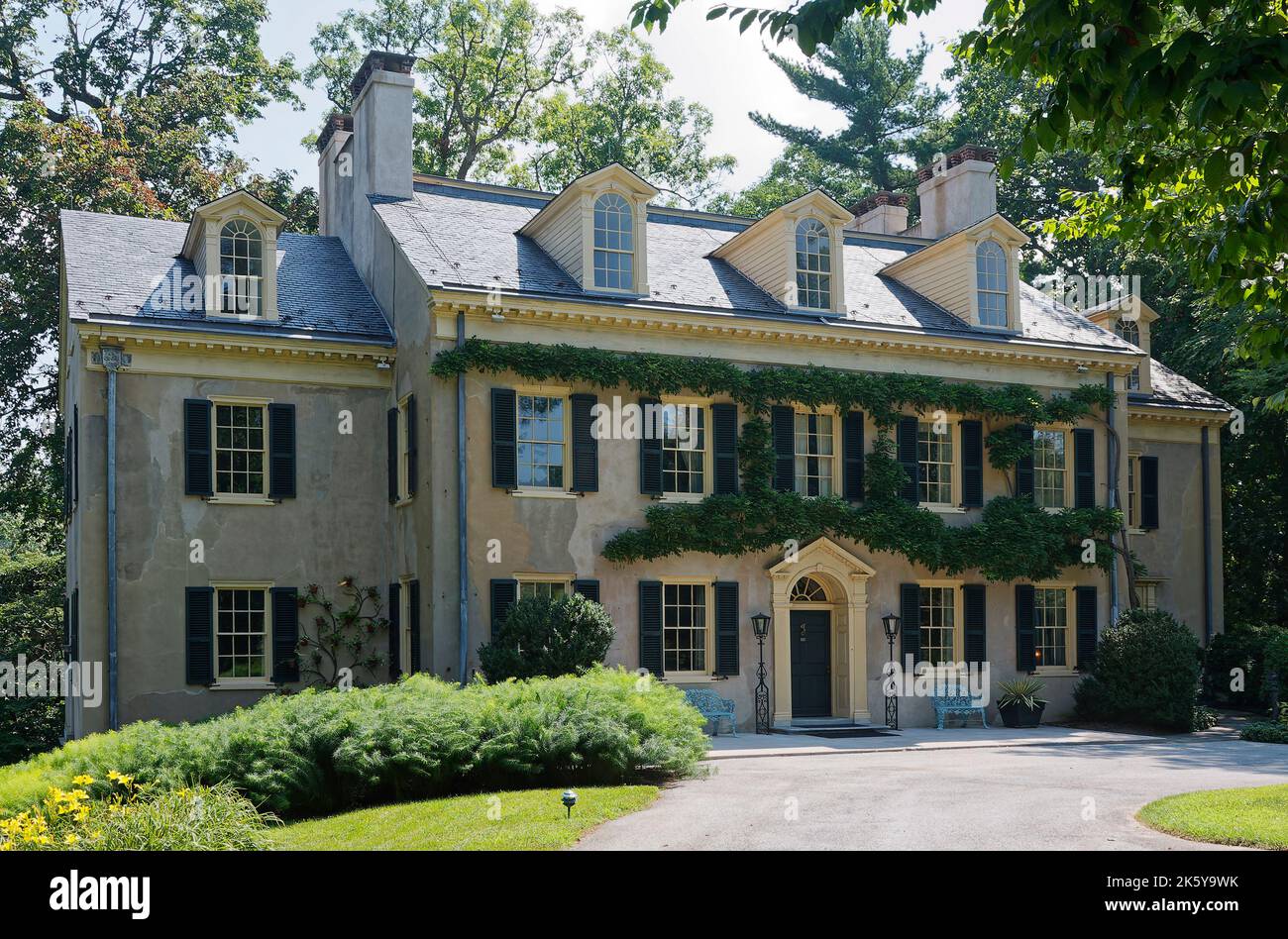E. I. DuPont residence, home, Georgian style, 1803, antique building, stucco, black shutters, symmetrical, dormer windows, Hagley Museum, Delaware, US Stock Photo