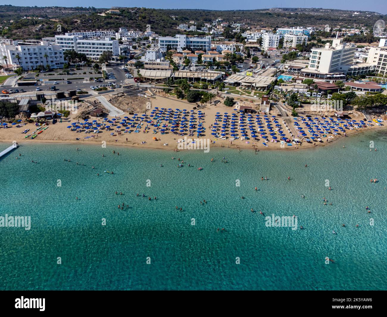 Aerial panoramic view on villas and holidays resorts and blue crystal ...