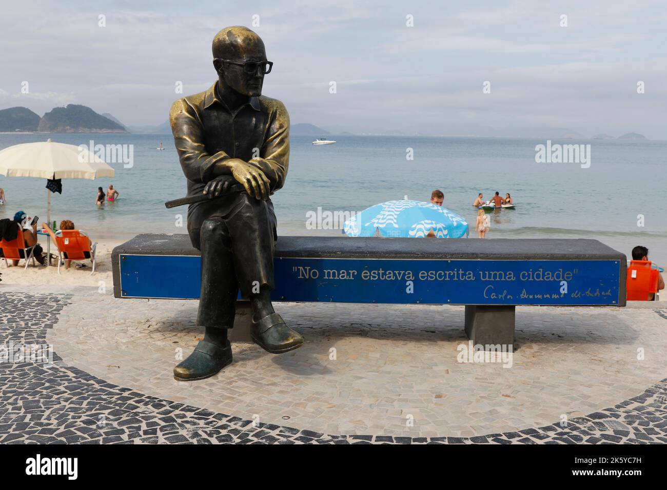 Statue of Carlos Drummond de Andrade at the Copacabana beach boardwalk. Tribute homage to famous brazilian poet writer Stock Photo