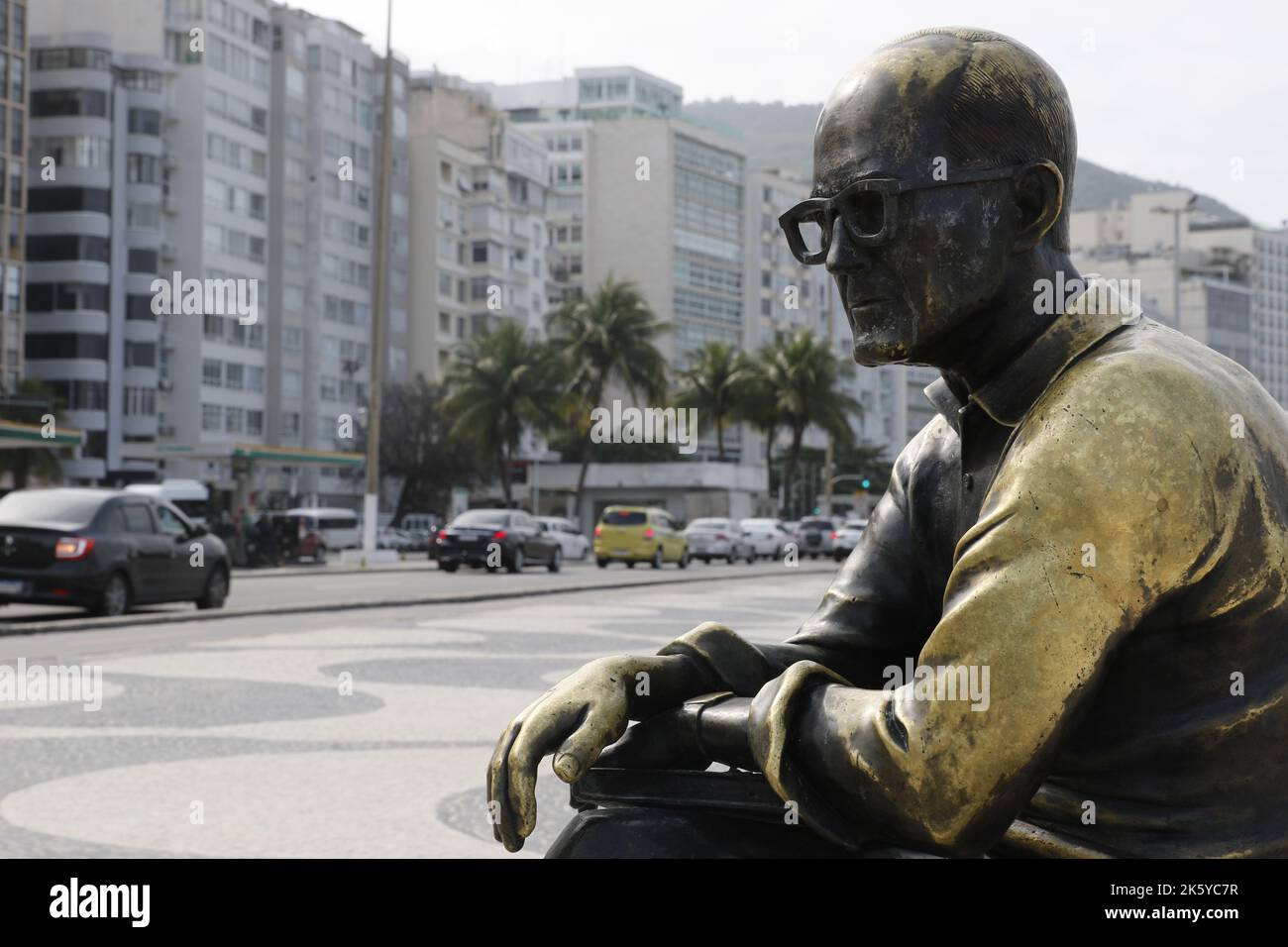 Statue of Carlos Drummond de Andrade at the Copacabana beach boardwalk. Tribute homage to famous brazilian poet writer Stock Photo