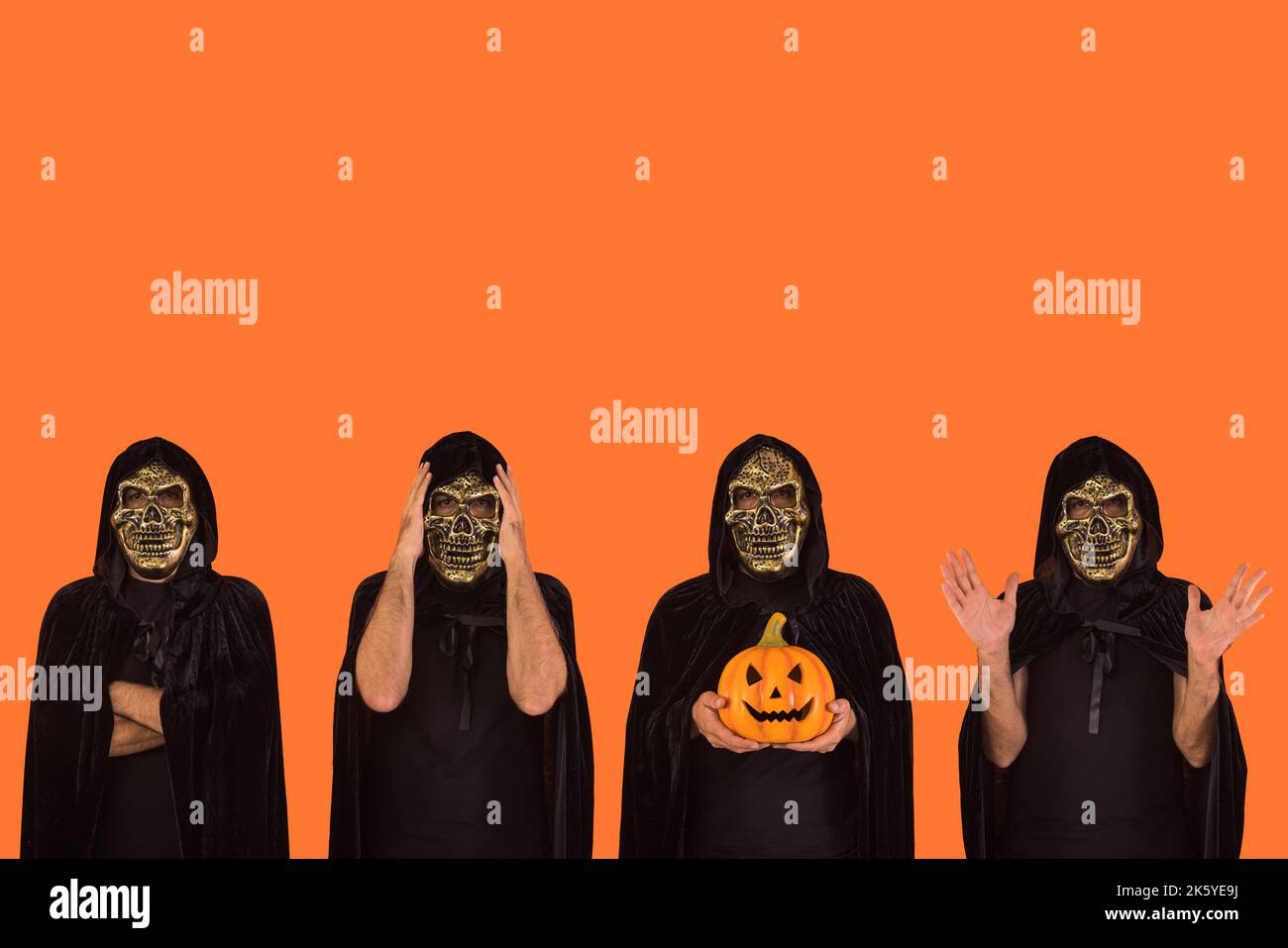 Various people with skull mask and black cape with hood, celebrating Halloween, on orange background. Celebration concept, All Souls' Day and All Sain Stock Photo