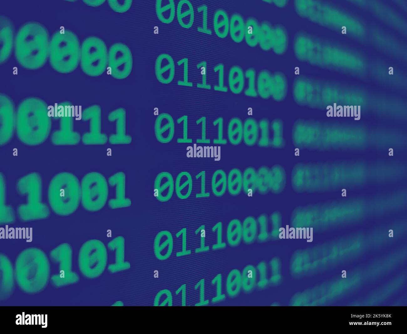 Closeup view of binary computer code with green 1s and 0s displayed on ...