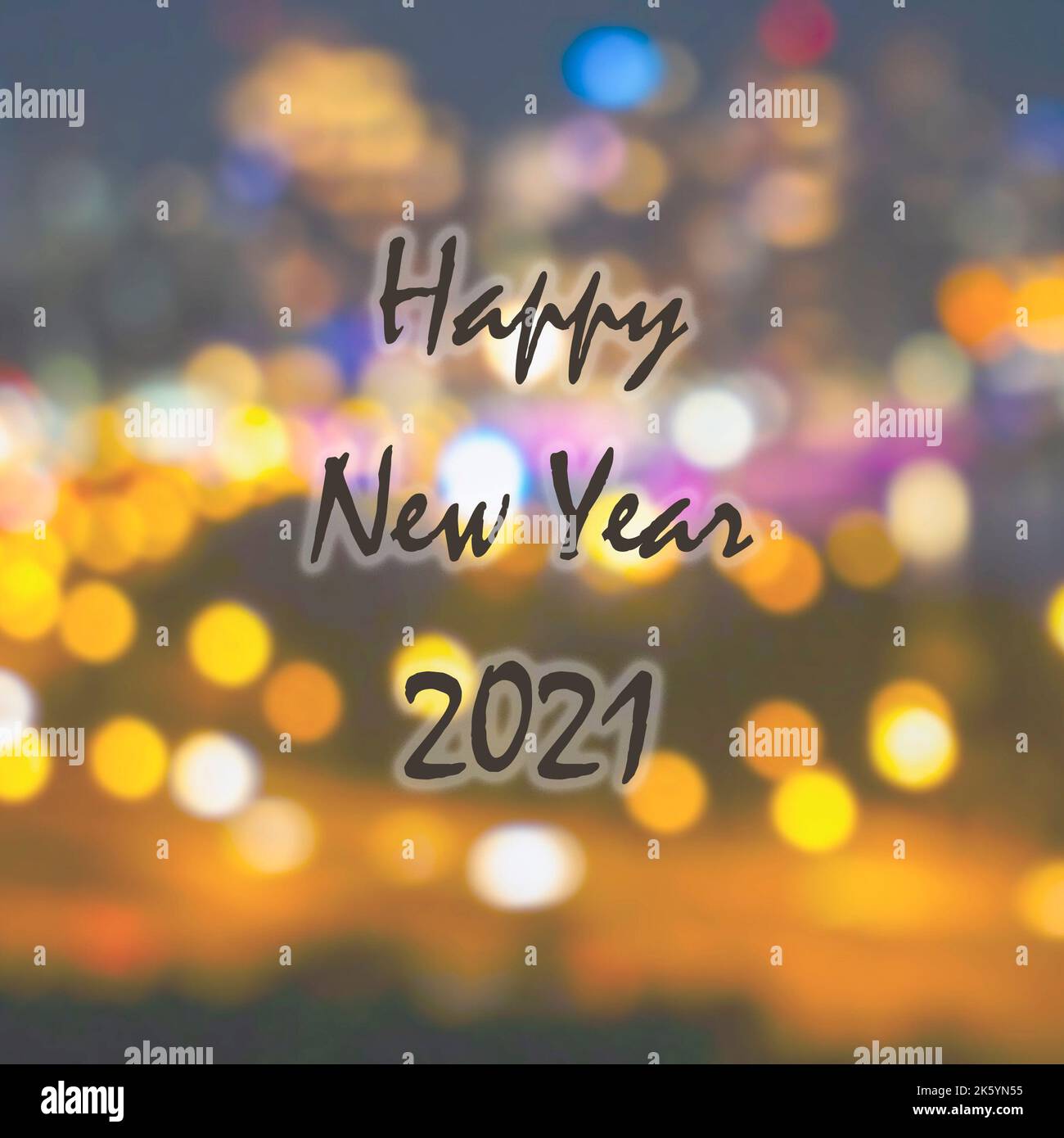 Happy New Year 2021 greetings on abstract defocused light bokeh for background Stock Photo