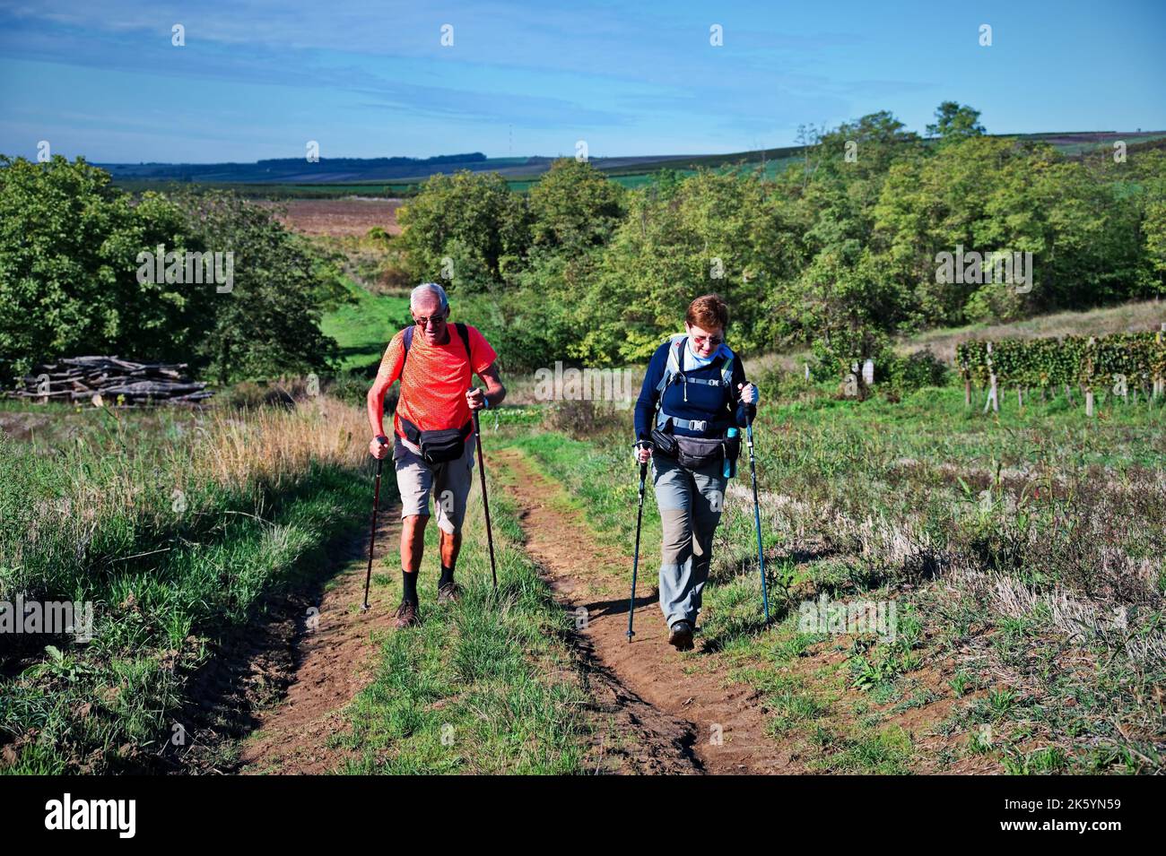 Couple trekking poles hiking hi-res stock photography and images - Alamy