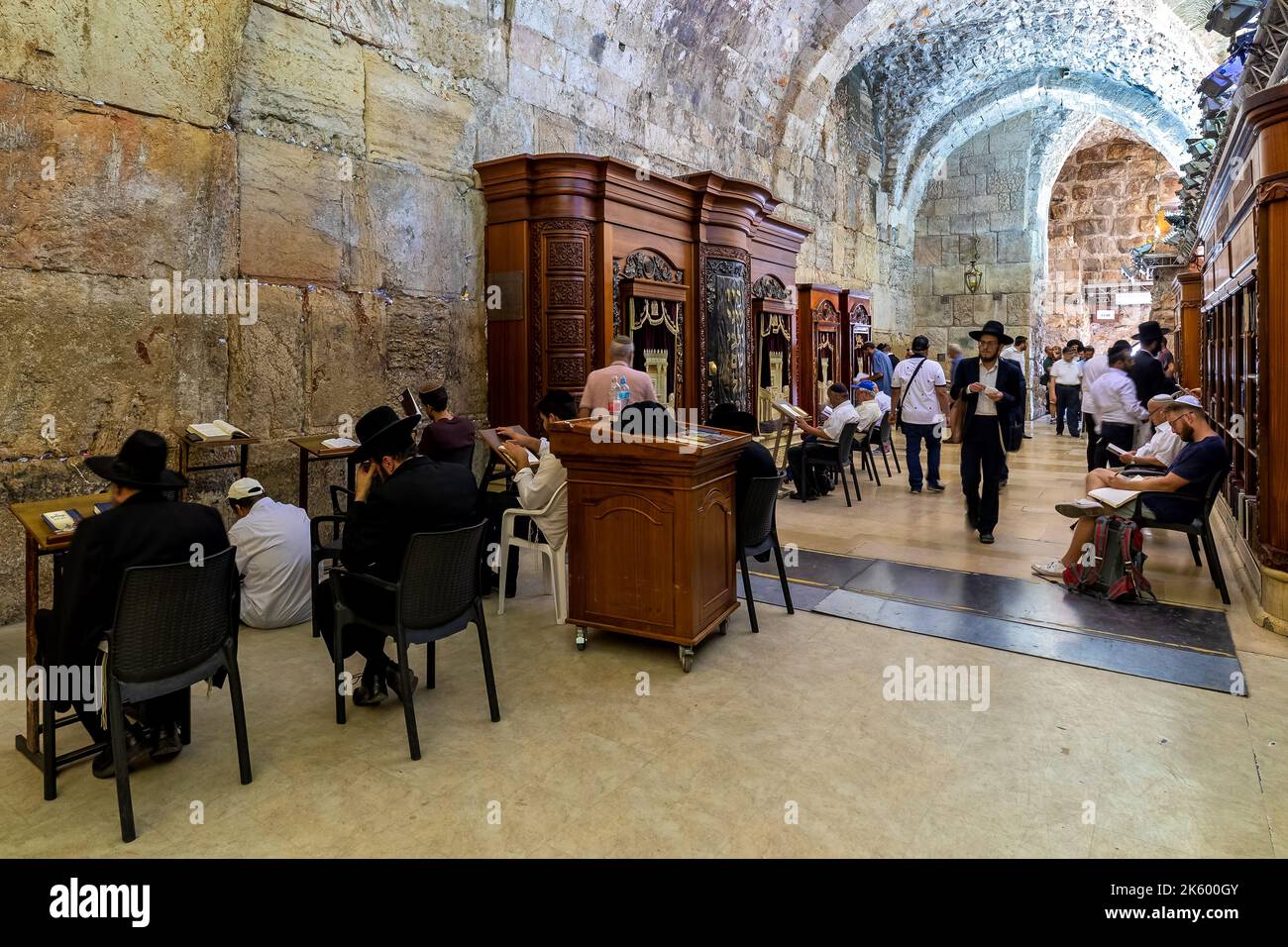 Prayers inside of the Cave Synagogue - interior covered part of the Western Wall (aka Wailing Wall) in Jerusalem, Israel. Stock Photo