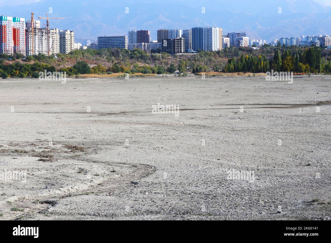 drainage of the lake in the city. the descent of water in the reservoir .dry lake Stock Photo