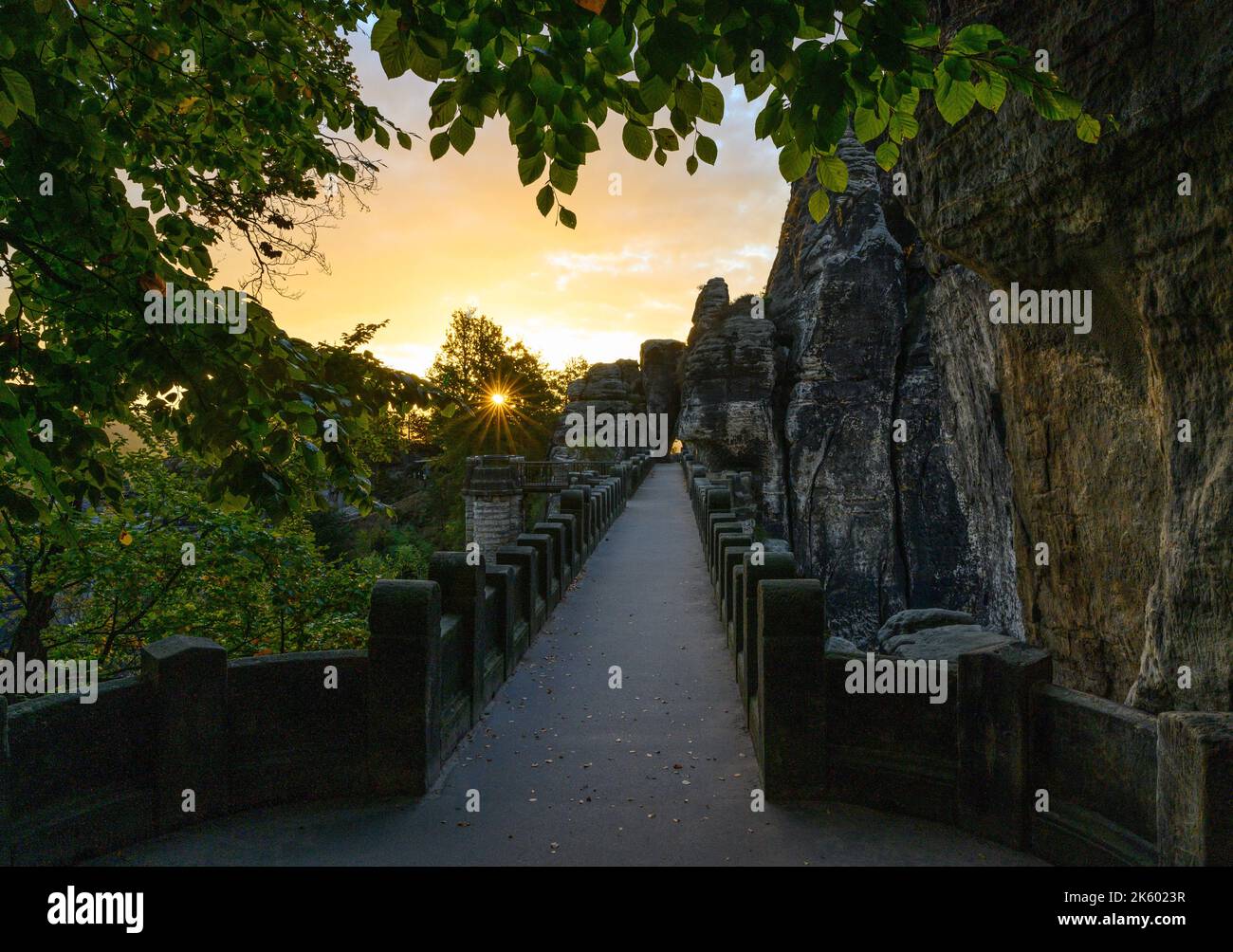 Rathen, Germany. 11th Oct, 2022. The sun rises in the morning over the Saxon Switzerland National Park next to the Bastei Bridge built in 1851. Credit: Robert Michael/dpa/Alamy Live News Stock Photo