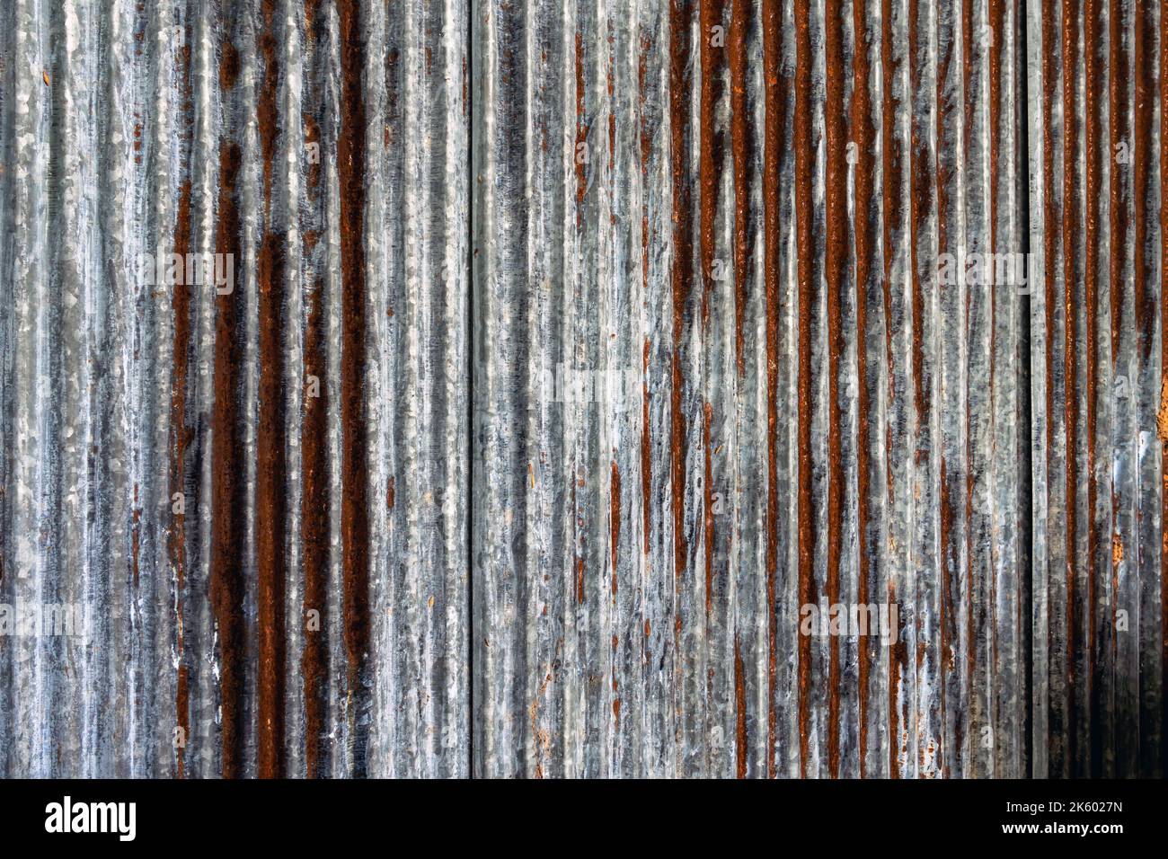 Artistic of old and rusty zinc sheet wall. Vintage style metal sheet