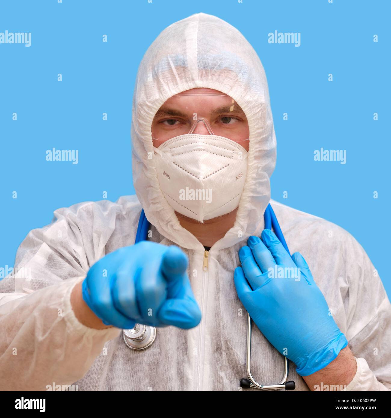 Man doctor medic in a protective suit uniform with goggles and face ...