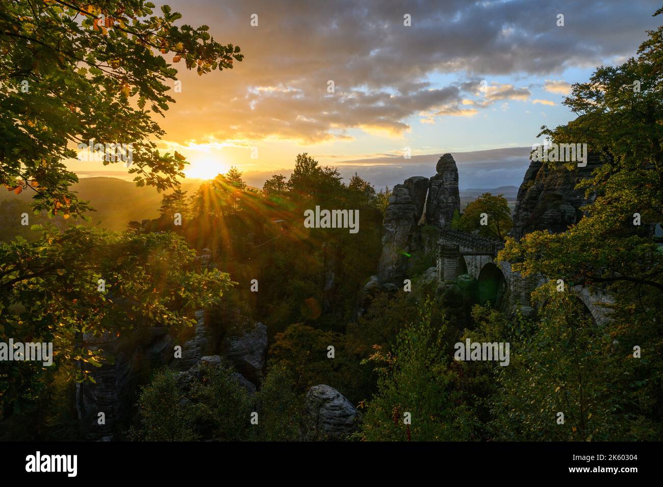 Rathen, Germany. 11th Oct, 2022. The sun rises in the morning over the Saxon Switzerland National Park next to the Bastei Bridge built in 1851. Credit: Robert Michael/dpa/Alamy Live News Stock Photo
