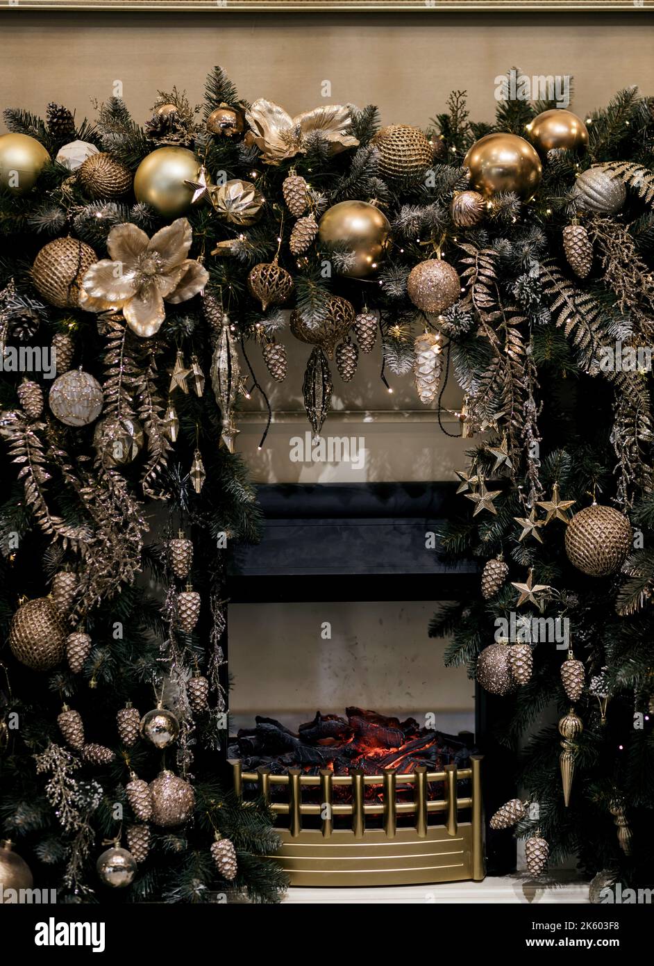 decorations for the Christmas tree in room with fireplace Stock Photo