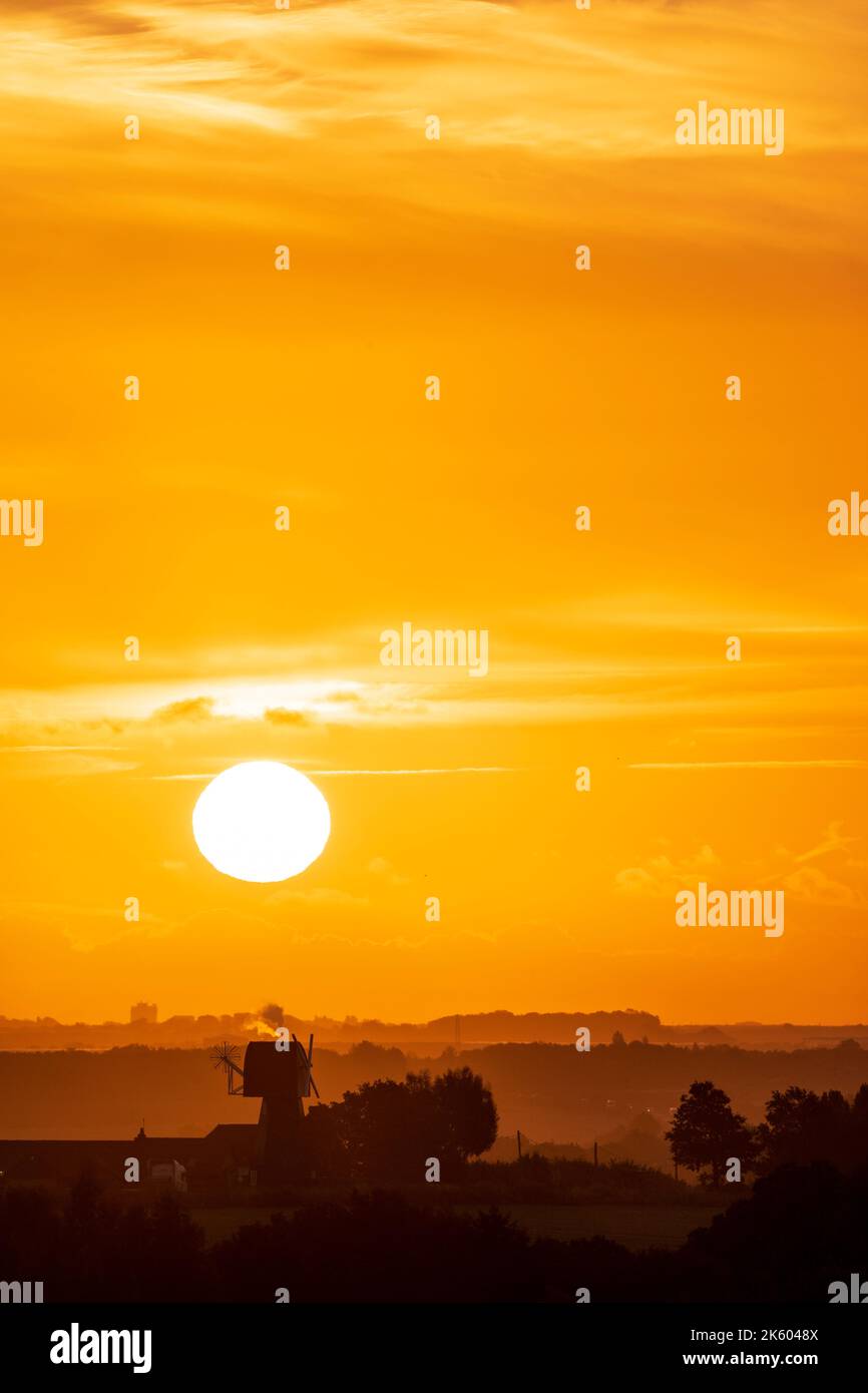 Sun Rise Without Editing Sunrise in an orange sky with some cloud over a landscape of hedgerows ...
