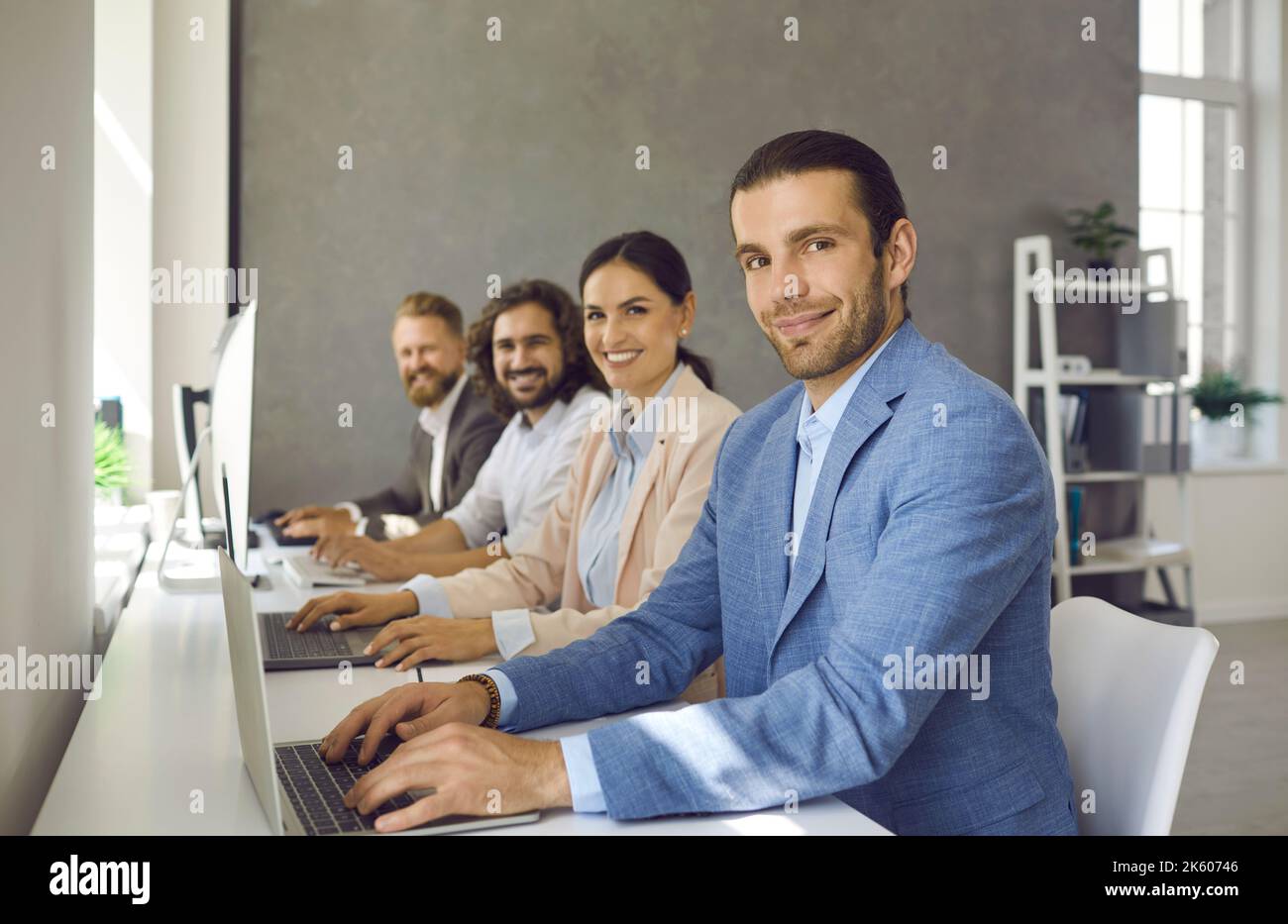 Team working desk using laptop hi-res stock photography and images - Alamy
