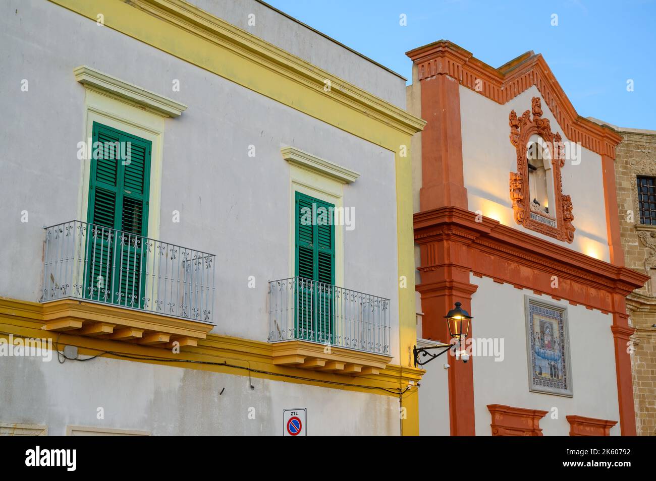Detail of facades of town house and Church of the Holy Crucifix in old