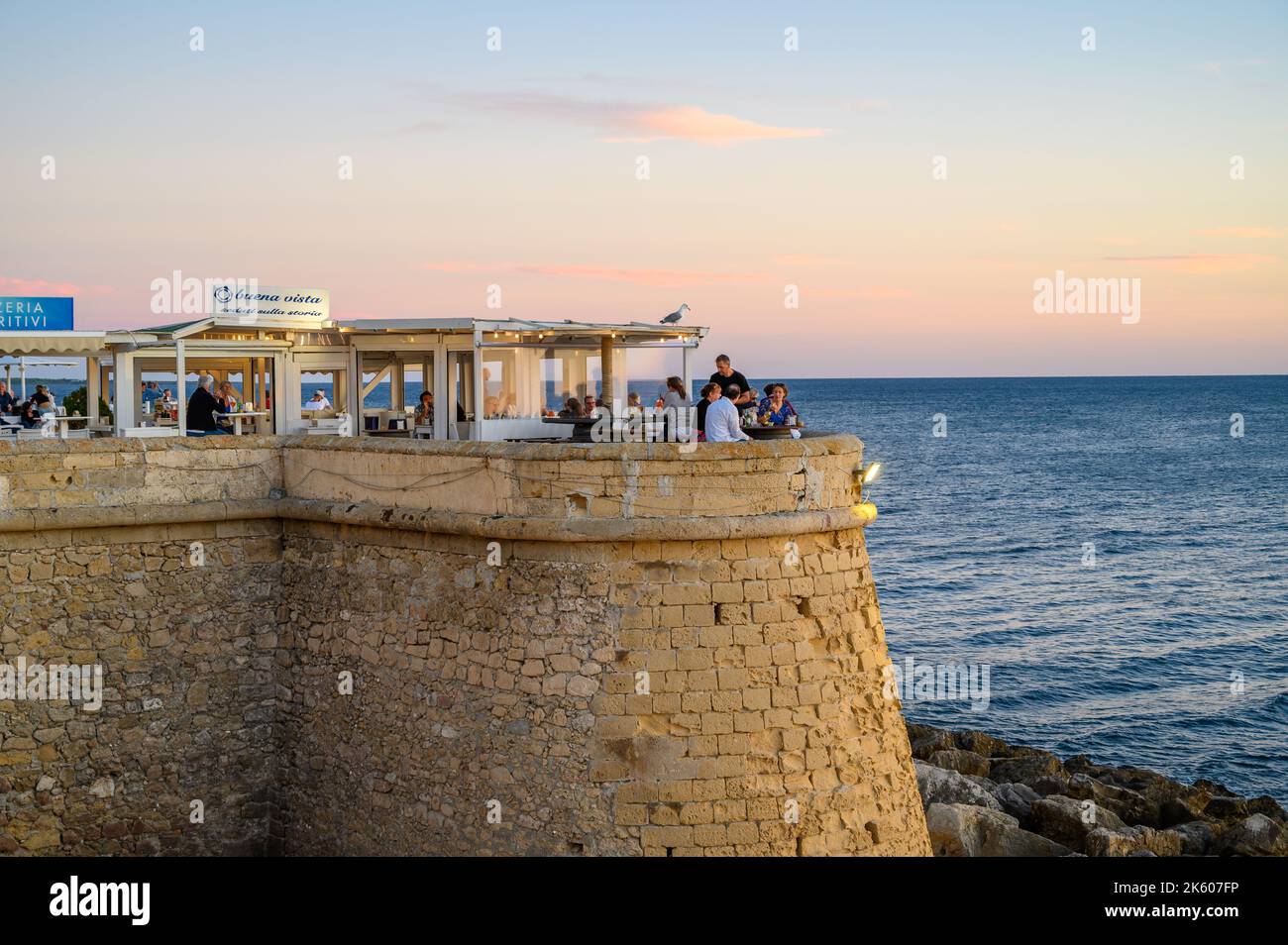People enjoying food and drinks at Buena Vista outdoor restaurant on