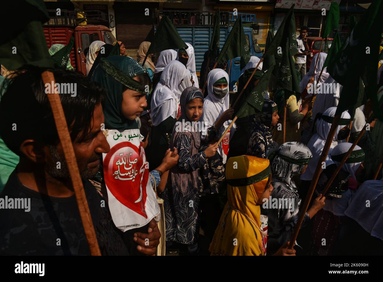 Srinagar, Jammu And Kashmir, India. 9th Oct, 2022. Small Kashmiri Muslim children taking part in Eid Milad-un-Nabi procession in the main city of Srinagar district on 09 October 2022. Eid-e-Milad, also called Maulid or Mawlid, is celebrated by singing hymns in praise of the Prophet. The Sunnis and the Shia sects celebrate the day differently. While the former holds prayers throughout the month and not mark the day as one of mourning, the latter believes that Prophet Muhammad chose Hazrat Ali as his successor on this day.Edi-e-Milad is celebrated in most Muslim-dominated countries by organis Stock Photo