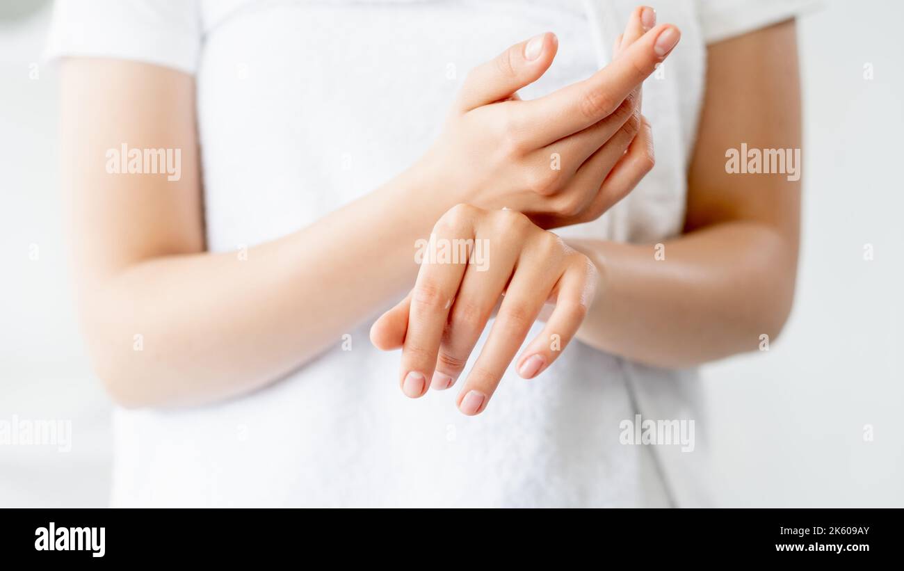 hand care skin moisturizing woman rubbing cream Stock Photo Alamy