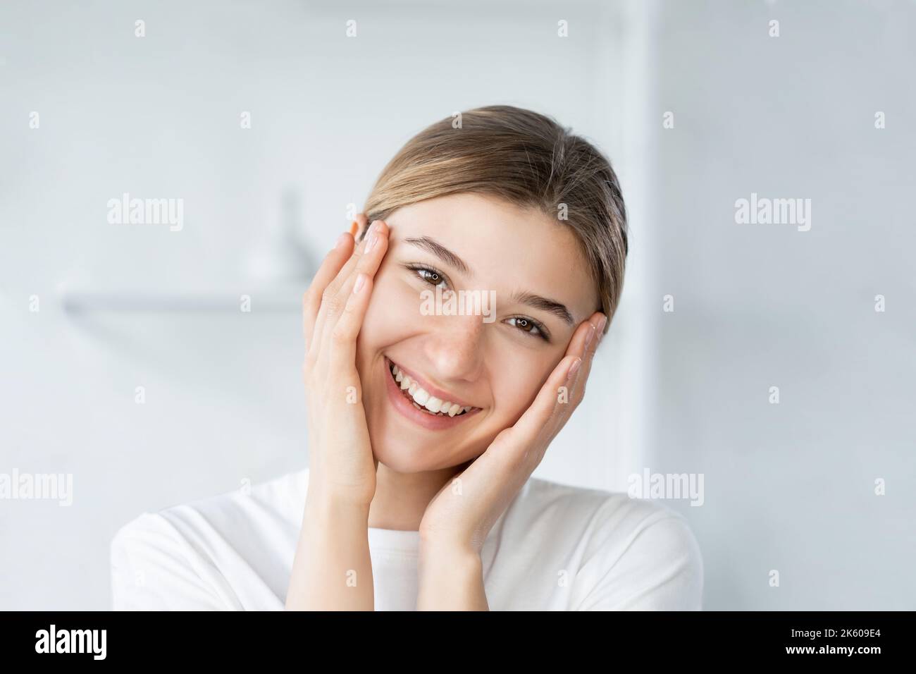 home skincare facial treatment smiling woman face Stock Photo