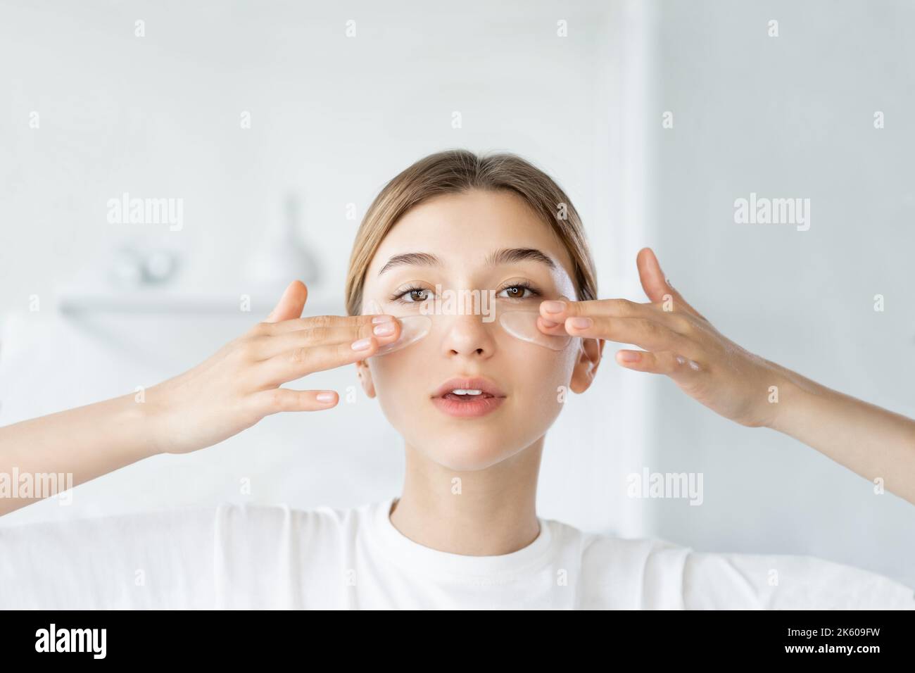 Woman applying skincare patches hi-res stock photography and images - Alamy