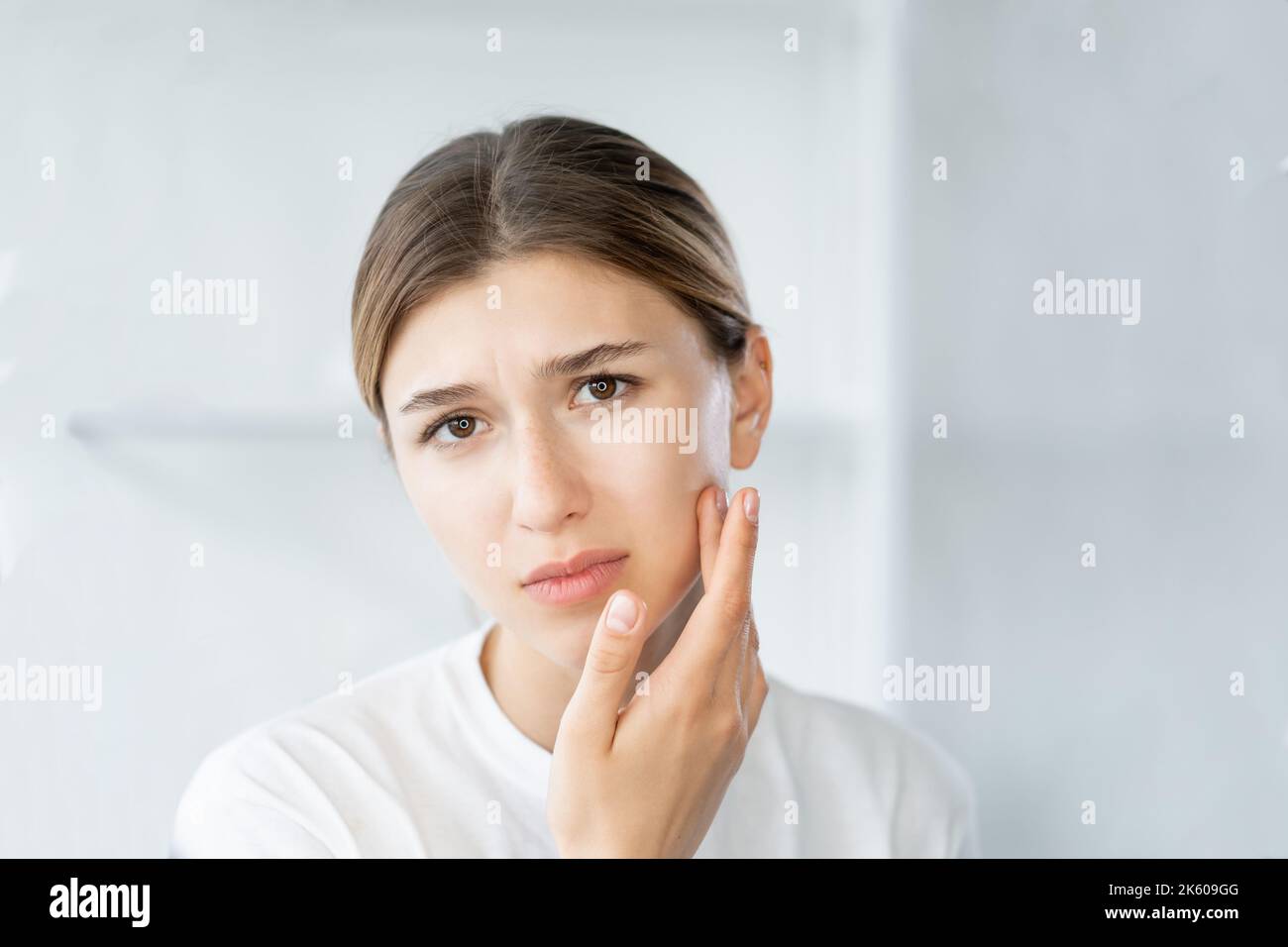 acne problem face inflammation woman touching skin Stock Photo Alamy