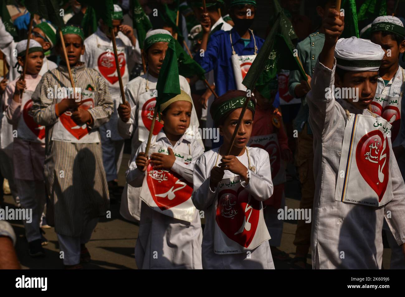 Srinagar, Jammu And Kashmir, India. 9th Oct, 2022. Small Kashmiri Muslim children taking part in Eid Milad-un-Nabi procession in the main city of Srinagar district on 09 October 2022. Eid-e-Milad, also called Maulid or Mawlid, is celebrated by singing hymns in praise of the Prophet. The Sunnis and the Shia sects celebrate the day differently. While the former holds prayers throughout the month and not mark the day as one of mourning, the latter believes that Prophet Muhammad chose Hazrat Ali as his successor on this day.Edi-e-Milad is celebrated in most Muslim-dominated countries by organis Stock Photo