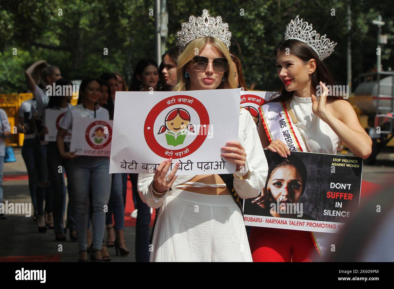 New Delhi, India, 11 October 2022. Beauty queen of Miss Supermodel Worldwide pageant from 25 countries hold placard during an international campaign for Save Girl Child and Domestic violence against women in New Delhi, India on International Day of the Girl Child 2022 on 11 October 2022. Photo by Anshuman Akash/ABACAPRESS.COM Stock Photo