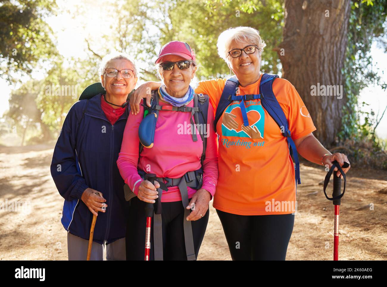 Senior women, hiking group and friends fitness in nature, park and forest for healthy lifestyle