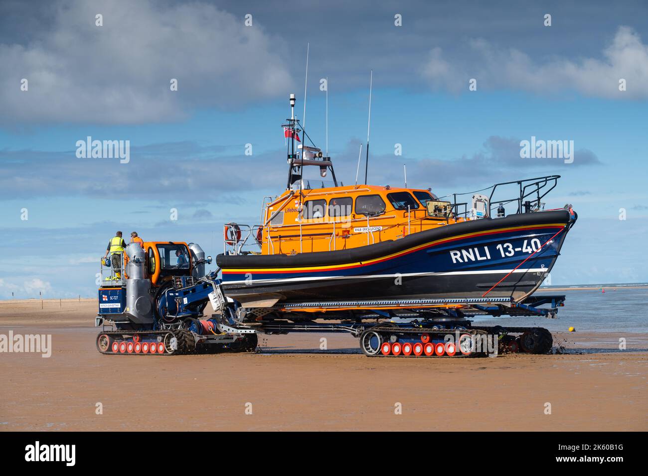 The RNLI Lifeboat stationed in Wells next the Sea, North Norfolk, UK being towed out to sea Stock Photo