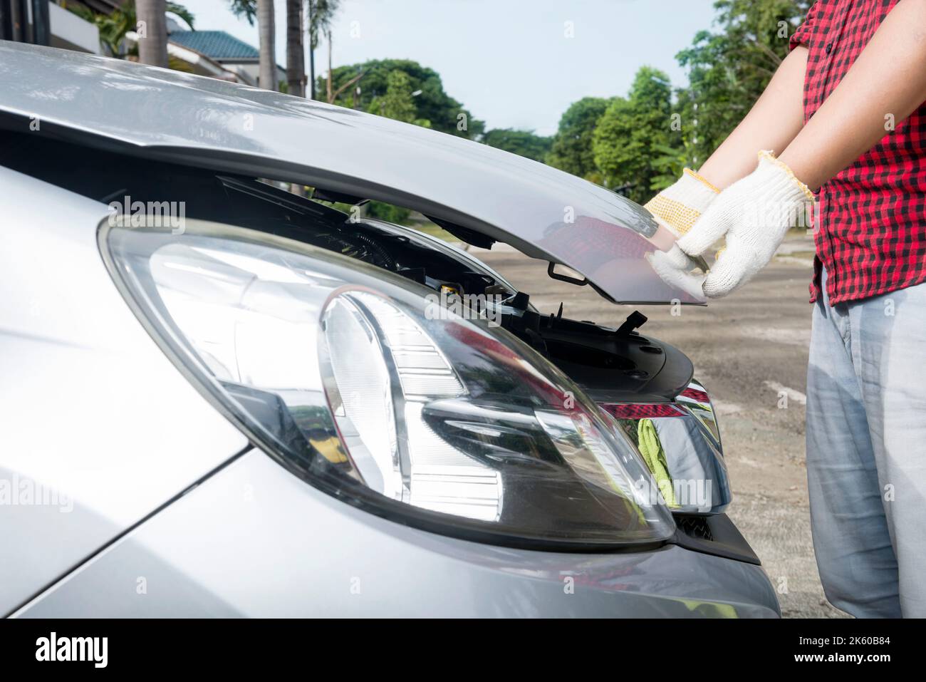 Car mechanic working on engine repair in the garage Stock Photo - Alamy