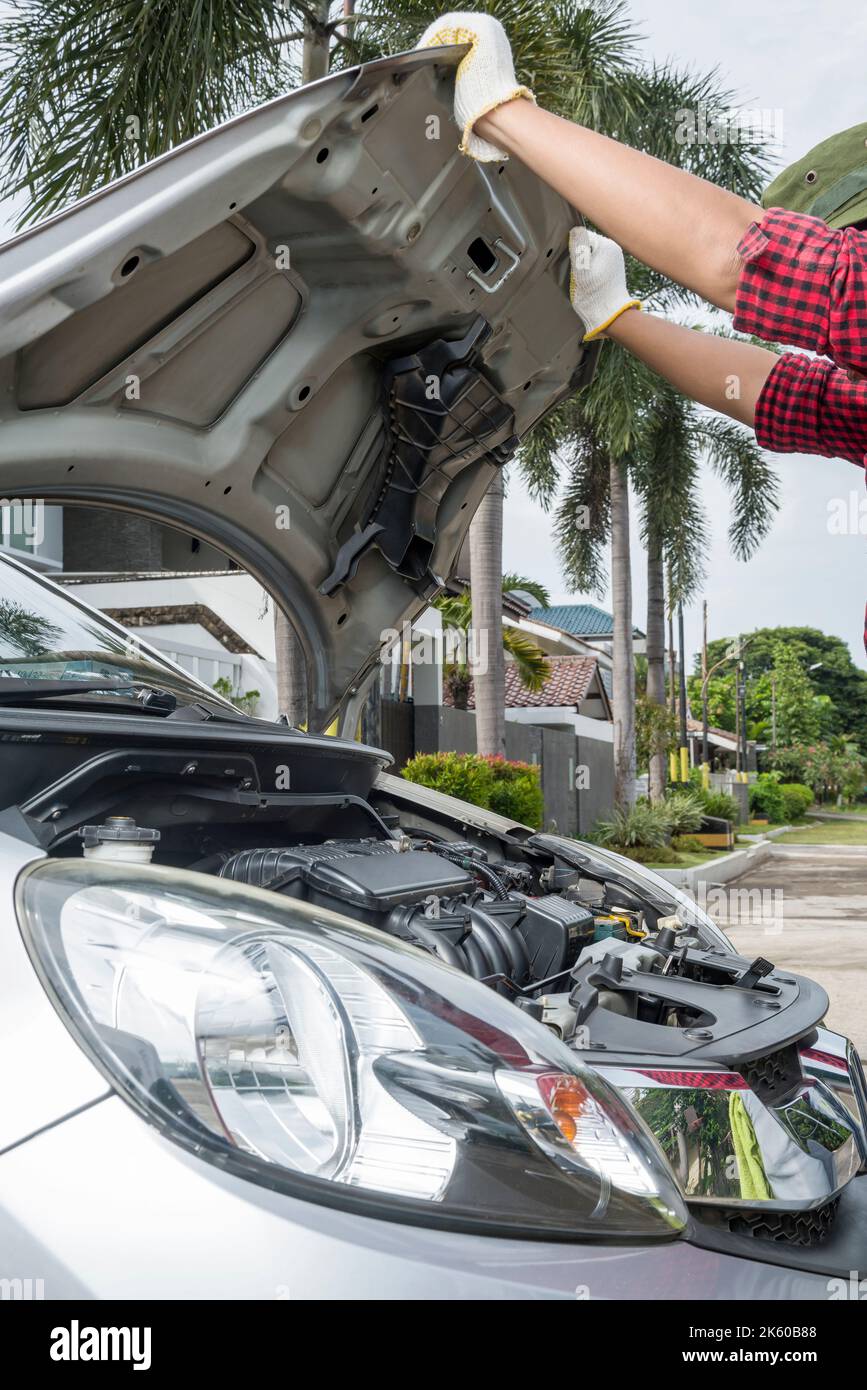 Car mechanic working on engine repair in the garage Stock Photo - Alamy