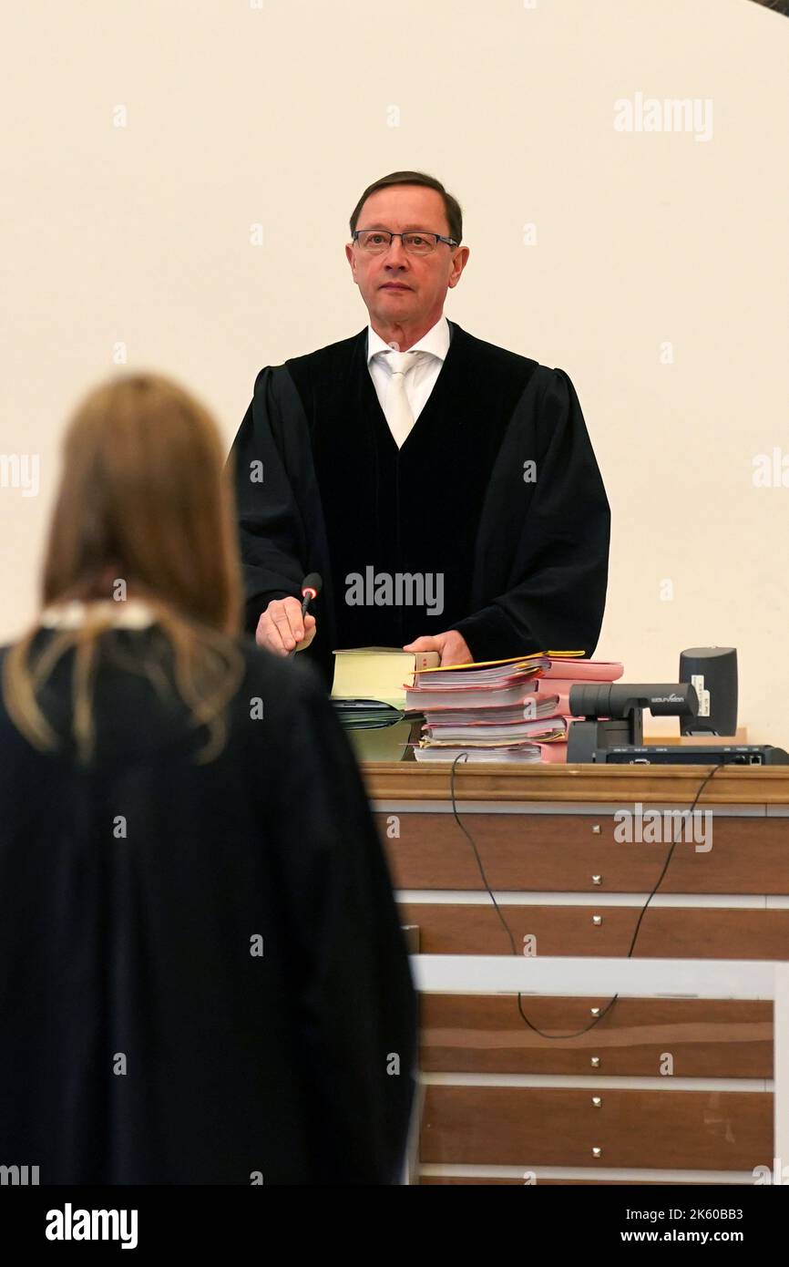 Koblenz, Germany. 11th Oct, 2022. Judge Thomas Metzger opens the trial at Koblenz Regional Court for investment fraud amounting to millions. The seven defendants - five men and two women - aged between 33 and 66 are alleged to have defrauded around 200 people as members of a criminal organization in the alleged online trade in financial production. The total damage is said to have amounted to 9.9 million euros, according to the indictment, Regional Court. Credit: Thomas Frey/dpa/Alamy Live News Stock Photo