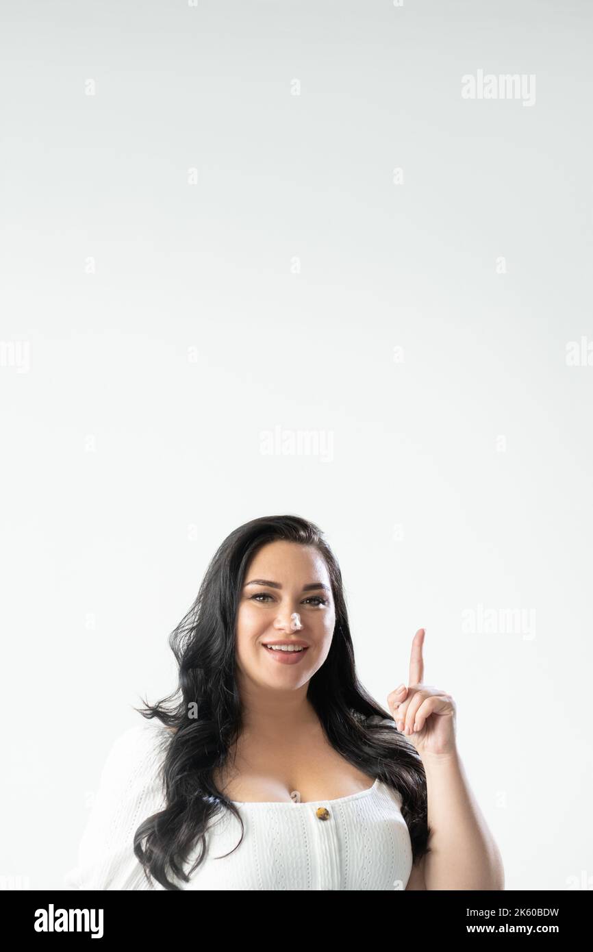pointing gesture inspired woman advertising Stock Photo