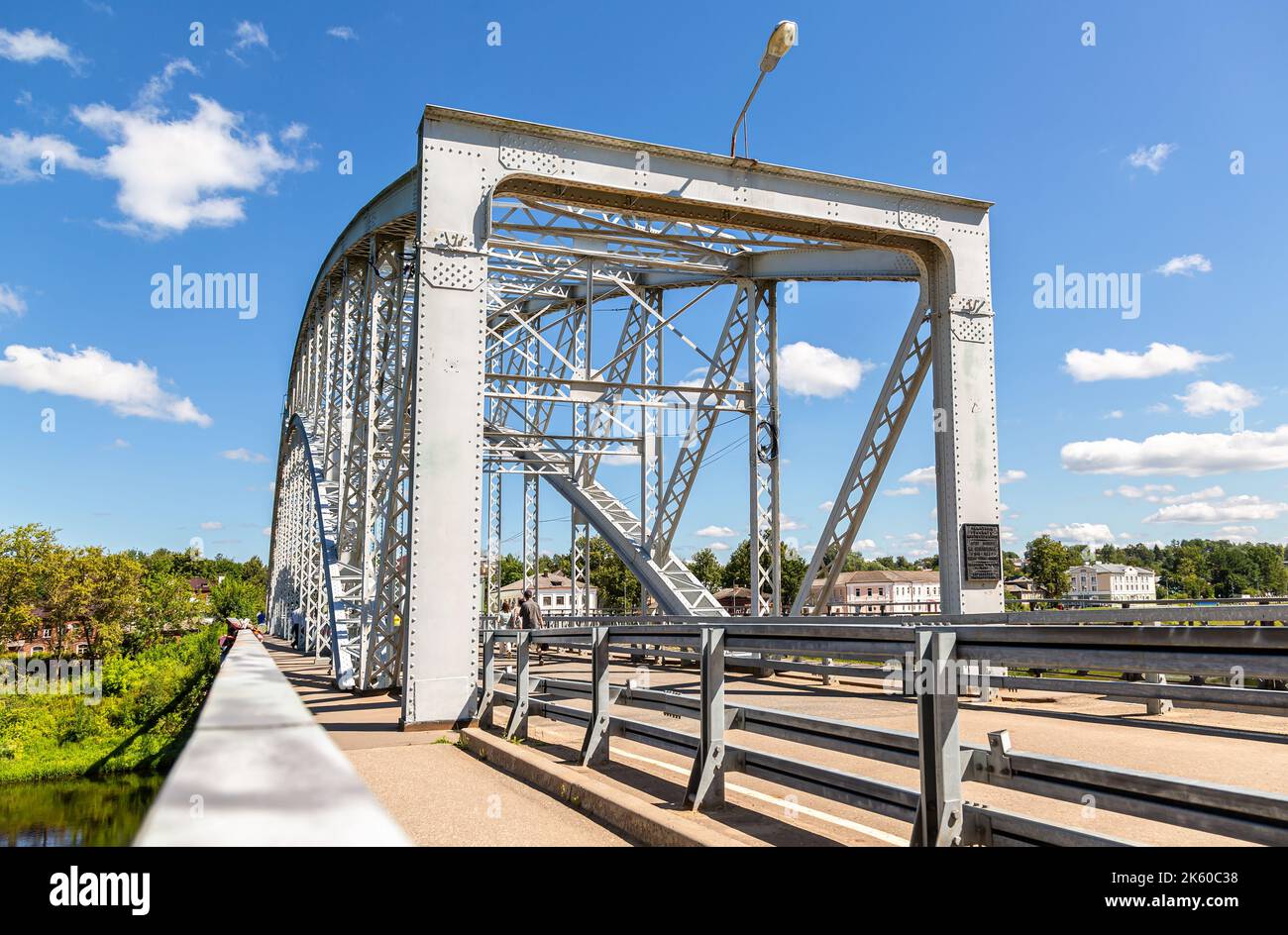 Borovichi, Russia - July 22, 2022: Steel arch bridge across the Msta river in summer sunny day. Built in 1905 according to the project of engineer N. Stock Photo