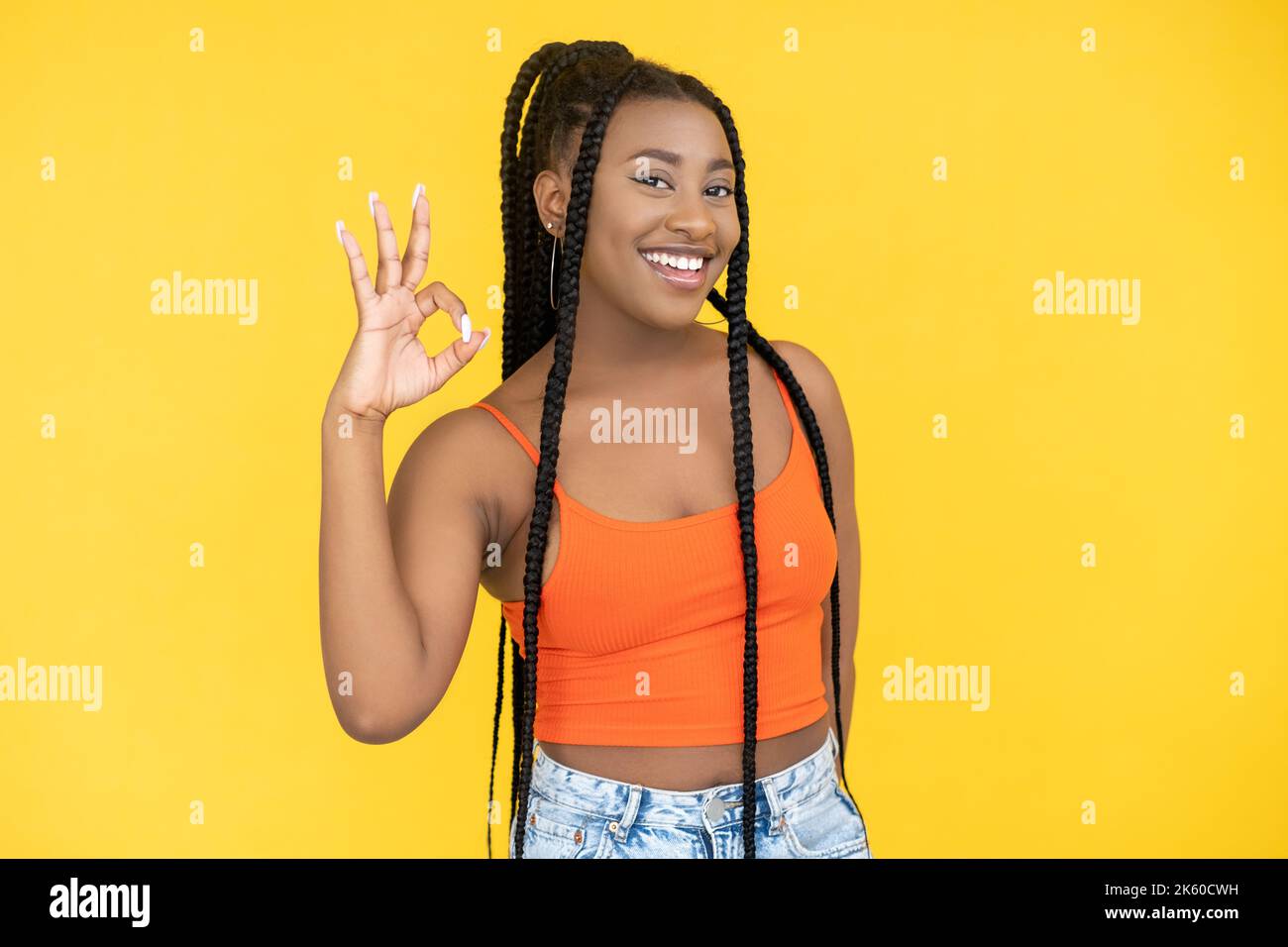 okay gesture agreement sign happy african woman Stock Photo - Alamy