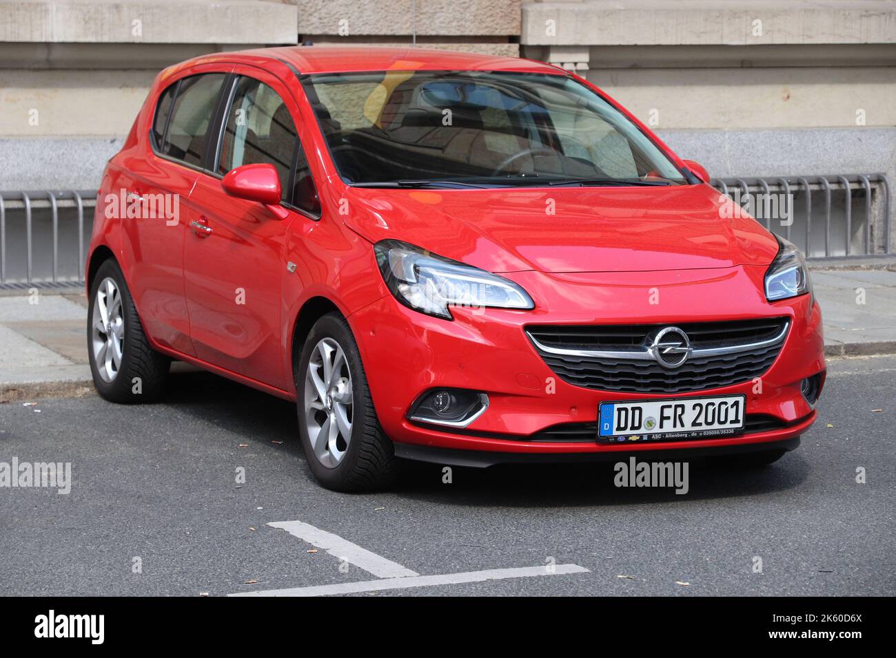 DRESDEN, GERMANY - MAY 10, 2018: Opel Corsa red hatchback small car parked in Germany. There were 45.8 million cars registered in Germany (as of 2017) Stock Photo