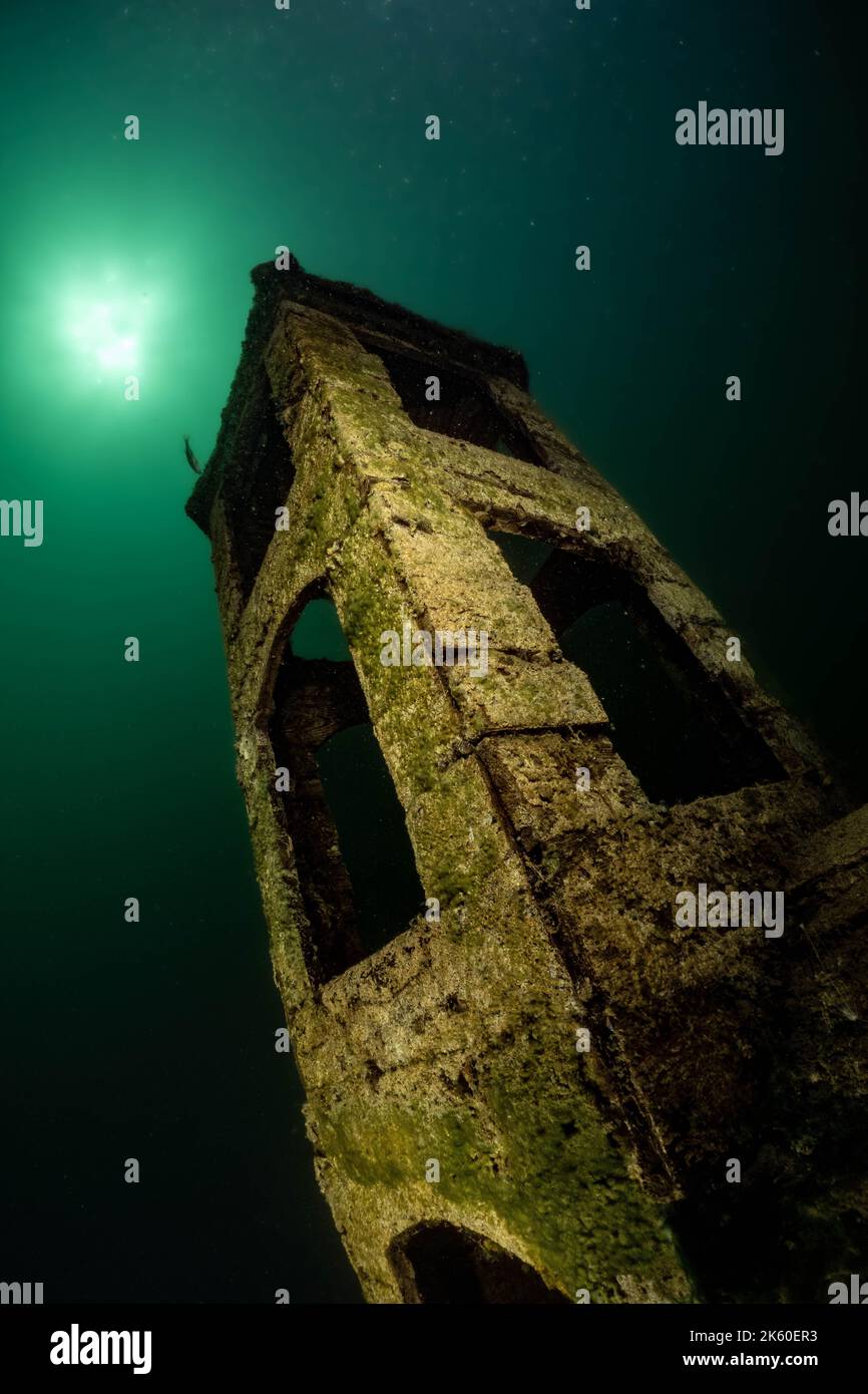 A haunting underwater church. Germany: IMAGES REVEAL an incredible underwater village that sits at the bottom of a Bavarian lake. One image shows an u Stock Photo